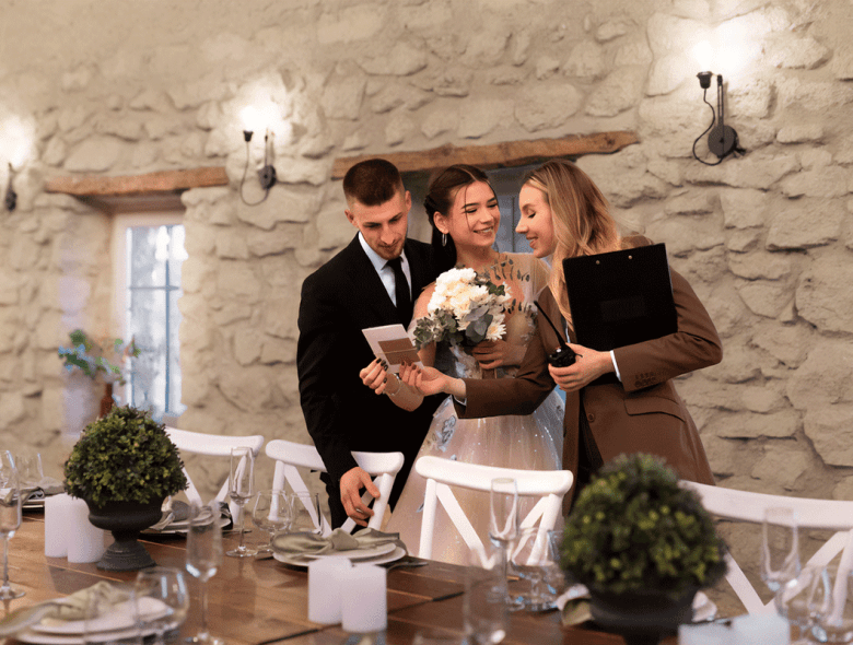 Event coordinator with a nuptial couple